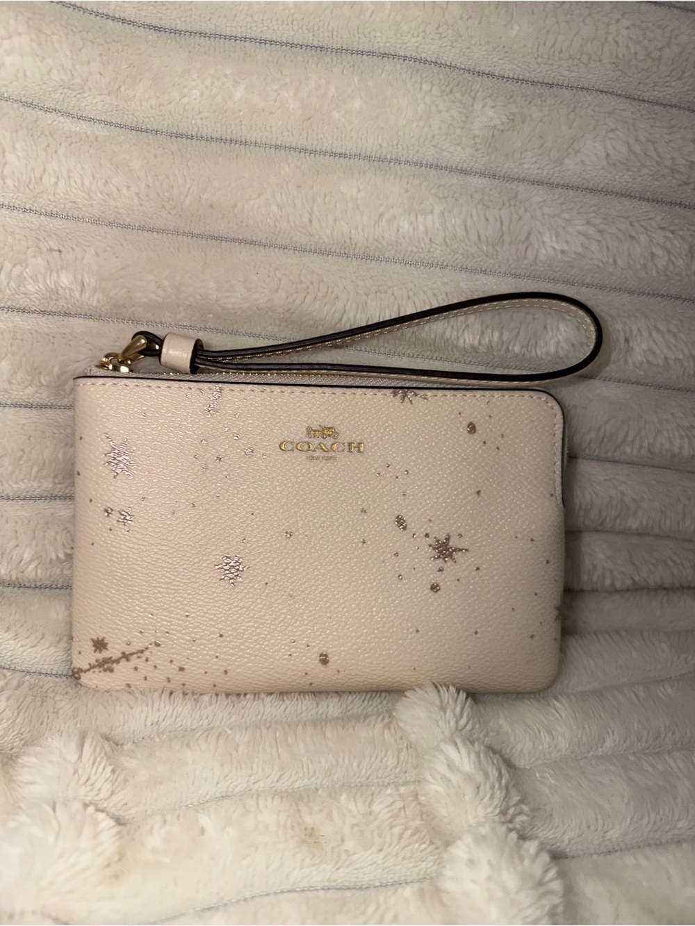 COACH Cream Wristlet with Metallic Star Print